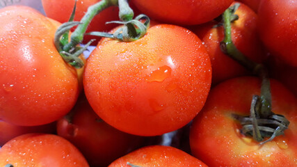 Close up fresh tometo on shelf in supermarket.