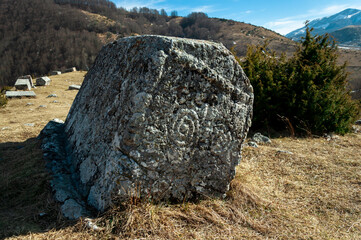 Abandoned ancient necropolis near a mountain village Umoljani. Tombstone called "stećak" was mostly built by Bosniak people of Bosnia and Herzegovina from 10th to 15th century AD.