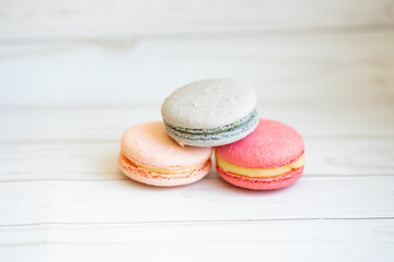 colorful macaroons on a wooden table