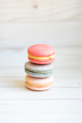 colorful macaroons on wooden background