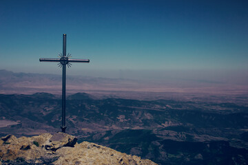 cross on top of a mountain