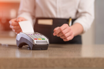 The waiter offers non-cash payment through a terminal, restaurant business or hotel, bank transfer