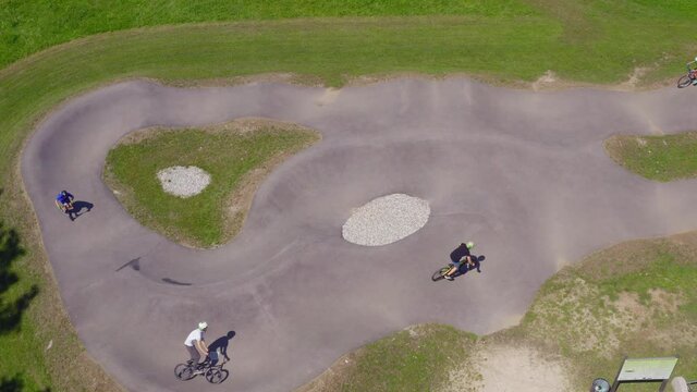 Active Kids Race On Pump Track. Adrenaline Fuelled Fun. Aerial View