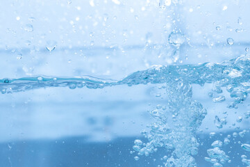 Water droplets moving in waves