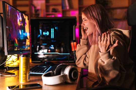 Image of displeased girl expressing irritation while playing video game