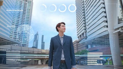 Slow Motion of Portrait Successful Asian Businessman walking on building city background with Futuristic Technological Blue Hologram Analyzing Data. Business Concept. - Powered by Adobe