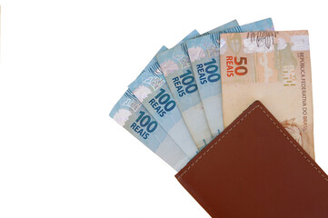 Brazilian Real banknotes in a wallet isolated on white background. Brazilian money.