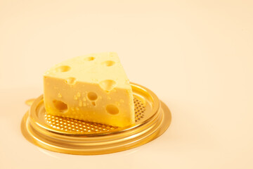piece of Cheese and Cheddar Cheese grated on old vintage Cooking wooden table. Cheese background Texture and Copy space