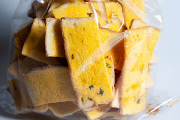 Garlic Bread in Plastic on Cooking table. Homemade Toasts garlic bread butter and herbs with Flour and eggs . Making Dessert Homemade concept.