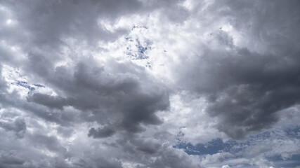 Picturesque clouds in the sky. Window view of an airplane on a sunny gloomy day. Stock photo background
