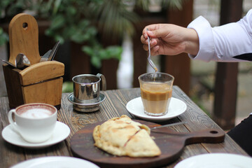 Calzone, pizza with smoked beef stuffing, and coffee