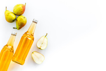 Bottles of beer with peer top view copy space