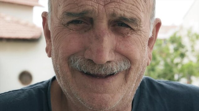 Angry old man portrait. Elderly man's close up face portrait