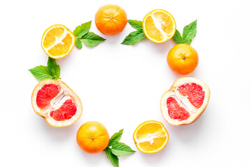 Frame sliced citrus mix white background top view