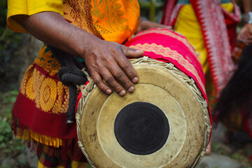  naga man playing drum , during hornbill festival in kohima -nagalang-india
