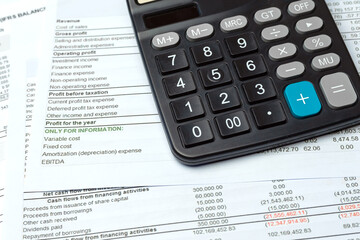 Close-up Calculator On Financial Report - Business Accounting Concept