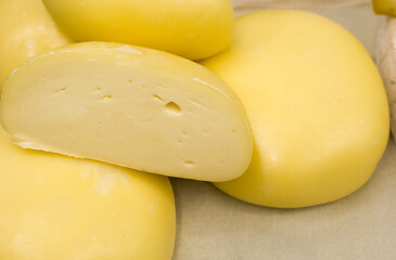 Dairy product. Fresh cheese on the table. Close-up - 358283984
