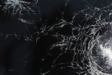 Crack on the glass. Broken screen. Broken phone. Cracked glass background. White cracks in the...