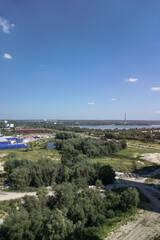 Outskirts of the city industrial zone on the background of a river or lake. Stock photo for design