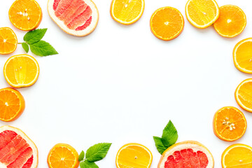 Frame sliced citrus mix white background top view