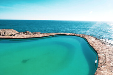 Fototapeta na wymiar swimming pool in front of sea