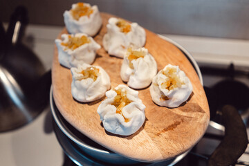 Dumplings on a wooden tray