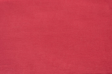 Pink denim textured background. Cotton fabric dyed pink. Backdrop.