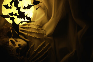 Black silhouettes of bats on a background of the moon. Halloween concept. Scary background. Frightening abstract objects for Halloween.