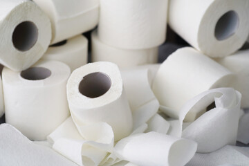 Toilet paper in a roll. Snow-white soft three-layer toilet paper. Lack of hygiene products. Primary protection and disinfection.