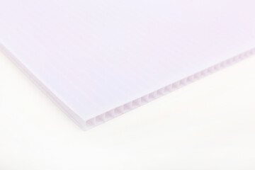 Polycarbonate plastic sheets panels images. PC hollow sheet for translucent roofing close up. Single white color on white background