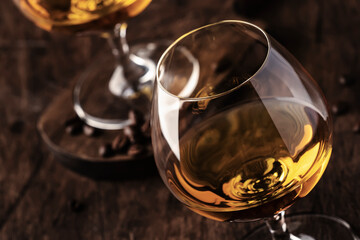 Armagnac, French grape brandy, strong alcoholic drink. Still life in vintage style, selective focus