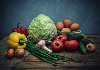 Still life with vegetables on a wooden table