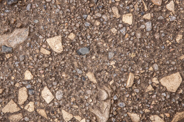 background and texture trodden path with stones closeup