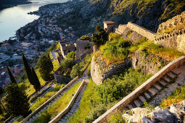 Path or road in mountains Kotor bay fort Montenegro beautiful tourism travel concept. Vacation mediterranean Europe trip. Bright summer fortress landmark landscape panorama