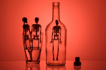 the contours of the bottle and glass in them the silhouette of skeletons