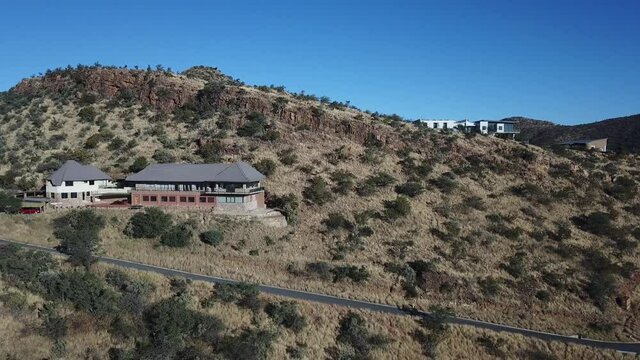 4K aerial drone video of Africa savanna hills, mansions and houses up n the mountains south of Windhoek in central highland Khomas Hochland of Namibia, southern Africa