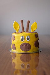 Happy giraffe face birthday cake - 358294357
