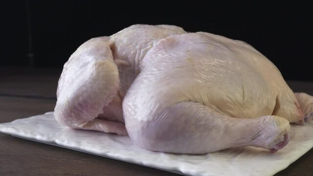 Peeled Broiler Chicken On A Black Background