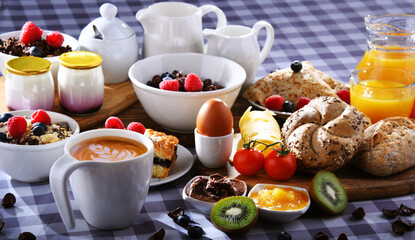 Breakfast served with coffee, juice, croissants and fruits