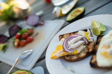 making burgers outside at summer picnic