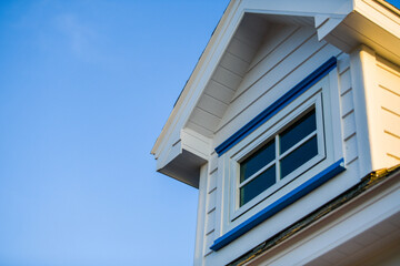 Close-up the window on the attic of the house