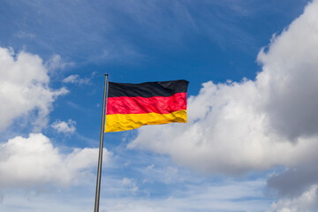 Germany flag on the blue sky background, Berlin
