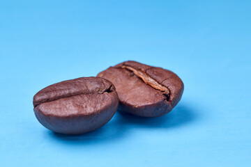roasted coffee beans on a blue background