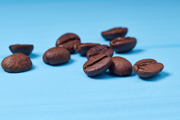 roasted coffee beans on a blue background