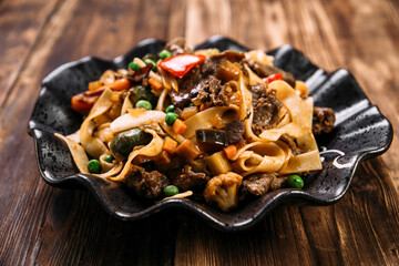 Asian style pasta tagliatelle beef and vegetables