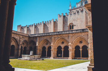 the wall of the monastery with interesting arches. Large cathedral with a garden