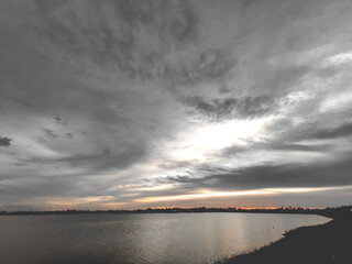 landscapes of the lake and cloudy concept black and orange tones.