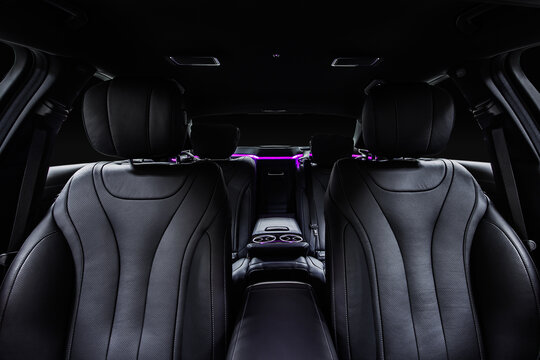 Interior of luxury car. Front black leather seats.