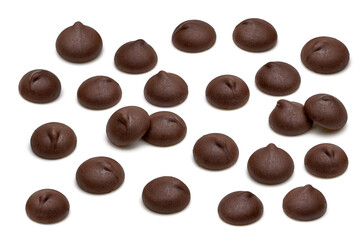 Chocolate chips morsels close up from top view isolated on white background. 
