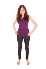 Full length fashion portrait of beautiful girl wearing black jeans and purple top, isolated on white background